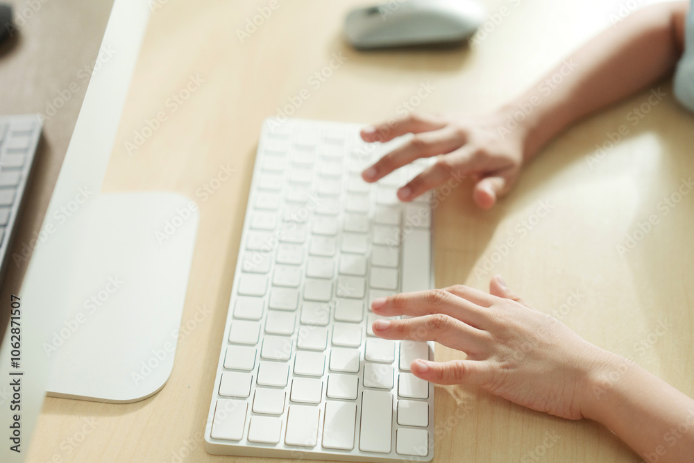 Close-up of a child's hand typing on a keyboard, with a warm and soft lighting effect Close-up of a child's hand typing on a keyboard, with a warm and soft lighting effect