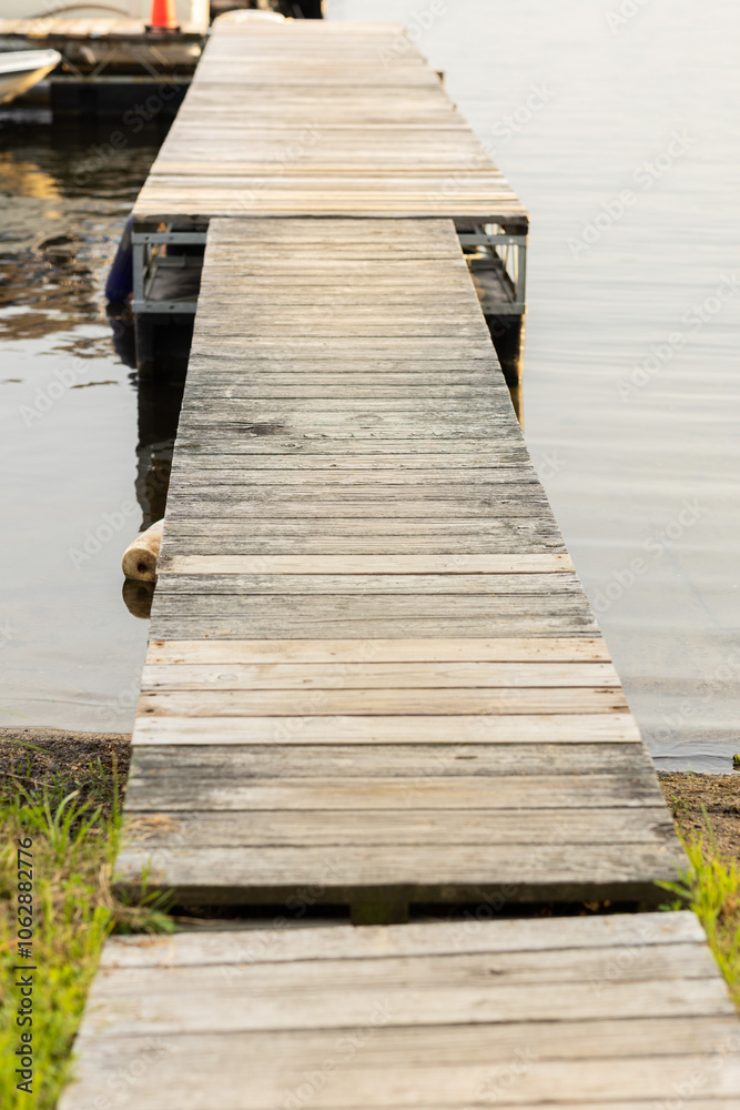 Fototapeta premium Vertical image of boat dock in a lake