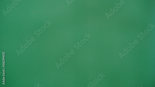 Subtle texture gradient is being created by a green grained background