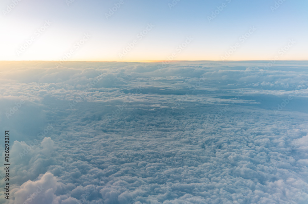 Beautiful orange and pink sunrise over the clouds, view from the plane. Beautiful orange and pink sunrise over the clouds, view from the plane.