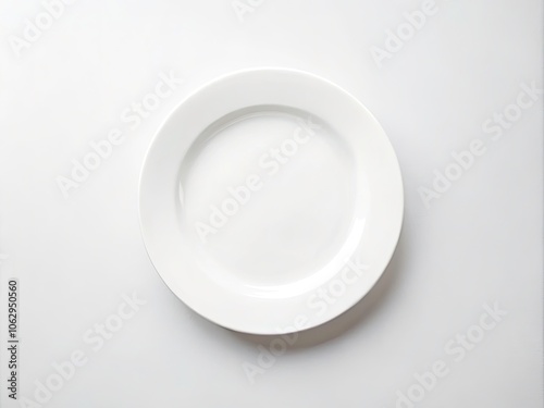 Elegant Top View of a Minimalist Empty White Ceramic Plate on a Clean White Background for Restaurant and Kitchen Settings