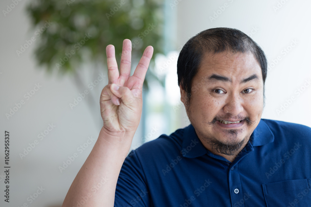 Confident happy smiling excited middle aged old asian man with hair loss pointing up 3 fingers, concept for three point, number three, 3rd place, numbering or counting numerals Confident happy smiling excited middle aged old asian man with hair loss pointing up 3 fingers, concept for three point, number three, 3rd place, numbering or counting numerals