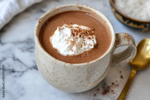 A cozy plant-based hot chocolate made with almond milk and rich dark cocoa, served with a dollop of coconut whipped cream, creating a warm and indulgent vegan beverage for chilly days photo