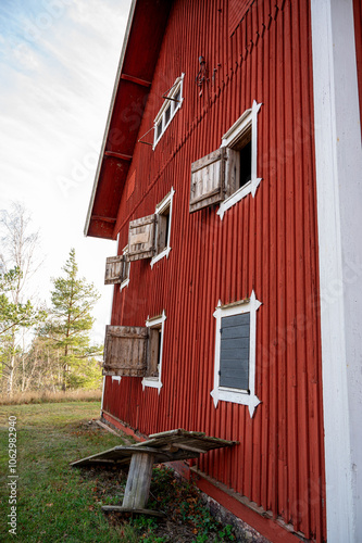 Flea market in old red wooden barn photo