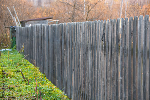 Wooden fence made of grey picket fence.
