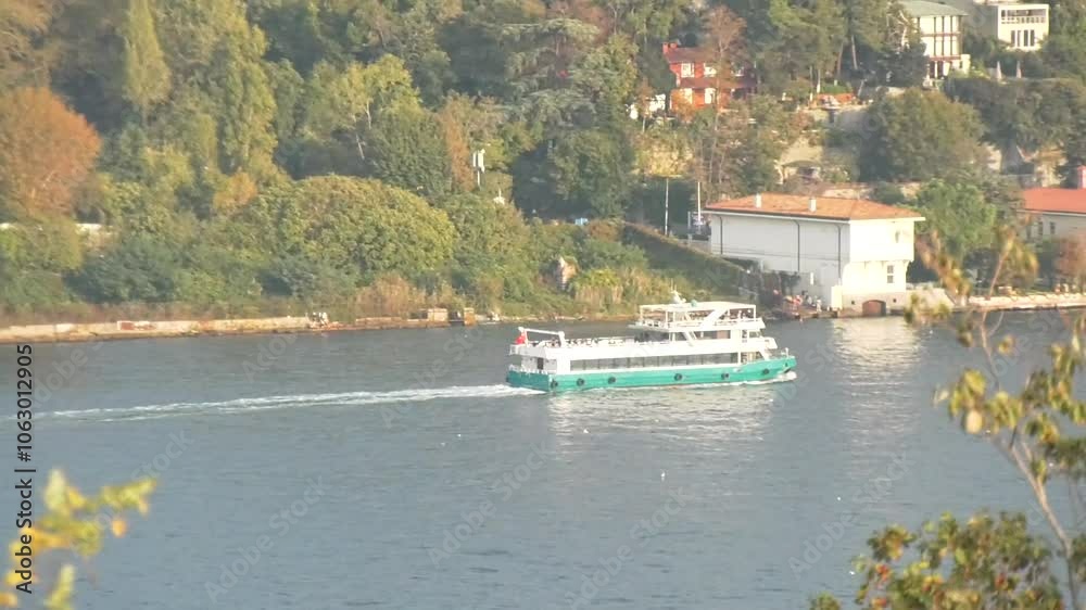 Stunning view of a ferry boat passing by the European shore of the Bosphorus Stunning view of a ferry boat passing by the European shore of the Bosphorus
