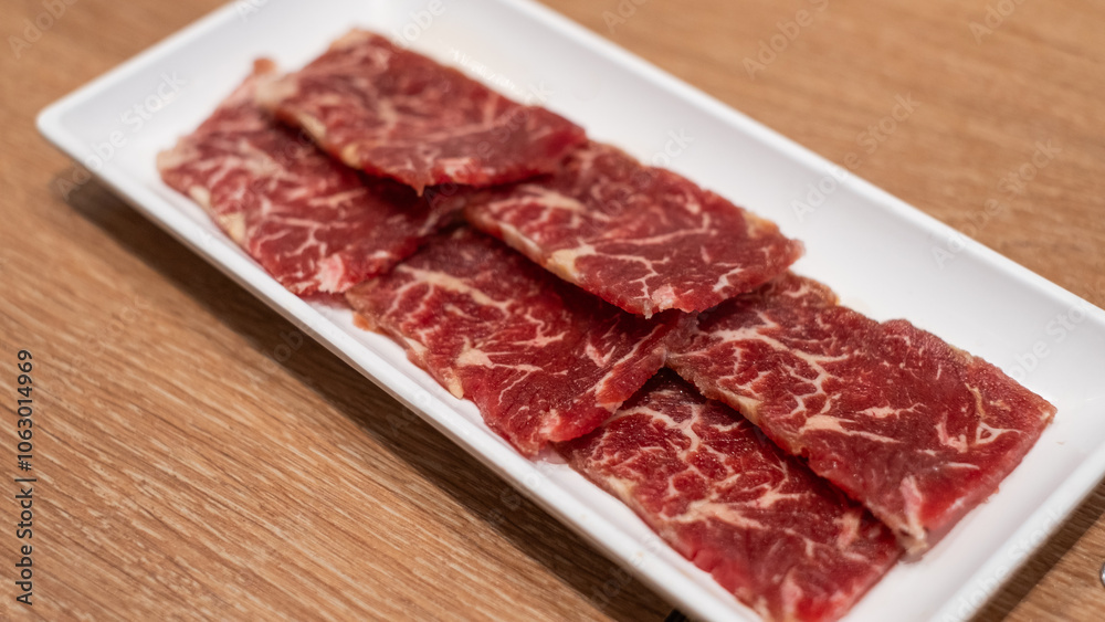 Delicious fresh raw juicy kobe wagyu marbled beef pork meat slice on plate ingredient for food sukiyaki yakiniku steak healthy meal Japanese traditional dining culture restaurant high protein bar-b-q Delicious fresh raw juicy kobe wagyu marbled beef pork meat slice on plate ingredient for food sukiyaki yakiniku steak healthy meal Japanese traditional dining culture restaurant high protein bar-b-q