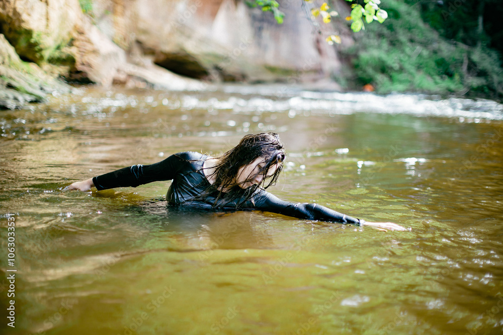 Fototapeta premium Graceful Movement in a Tranquil River Landscape