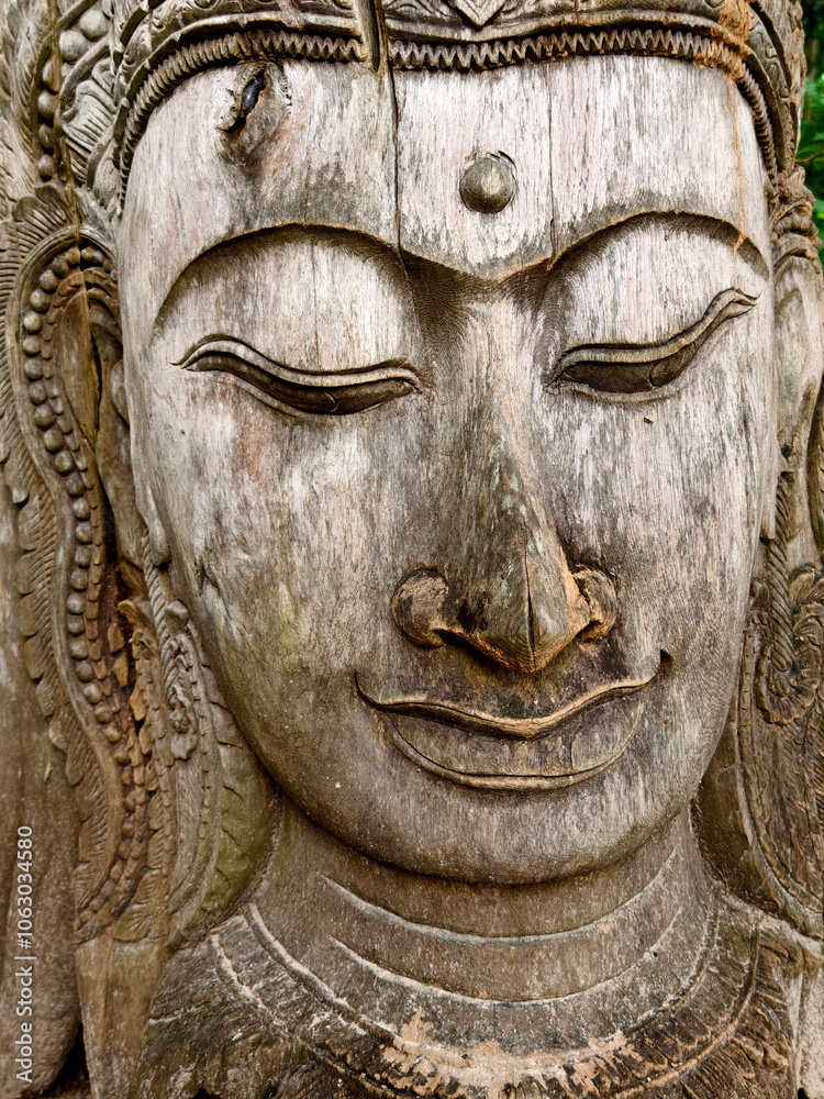 A stunning and beautiful tree sculpture showcasing a serene face A stunning and beautiful tree sculpture showcasing a serene face