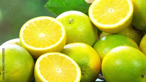 Acidless Orange Citrus sinensis or Som-Cang in Bamboo basket, Sweet Acidless Orange on on  green bokeh background.