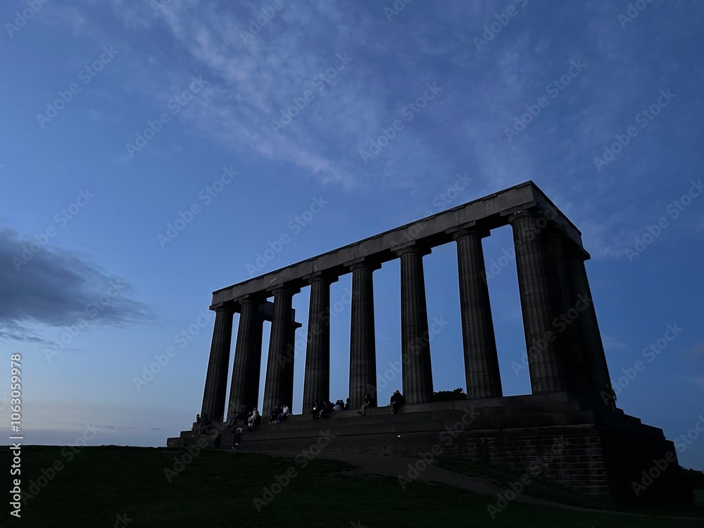National Monument of Scotland on Calton Hill during the blue hour, City of Edinburgh, Scotland, United Kingdom, August 2023 National Monument of Scotland on Calton Hill during the blue hour, City of Edinburgh, Scotland, United Kingdom, August 2023