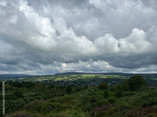 Clouds over the green hills of Yorkshire Dales near Ilkley, Bradford, England, United Kingdom, August 2023