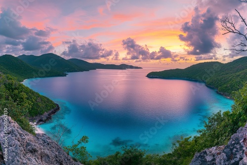 An exotic tropical bay boasts vibrant ocean hues, framed by lush cliffs under a spectacular sunset sky filled with colorful clouds, creating an idyllic paradise.