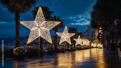 Fototapeta Naklejka Na Ścianę i Meble -  Christmas star lights brighten the streets of Nice on the Cote d'Azur in France.