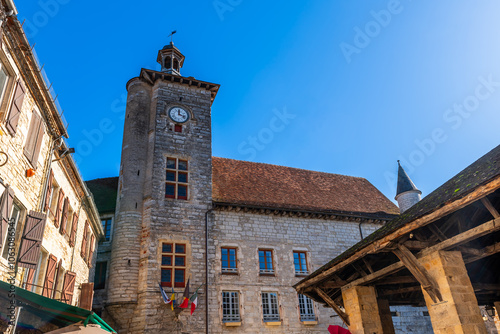 The Place de la Halle and clock tower, in Martel, in the Lot, in Occitanie, France photo