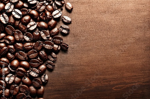 A white coffee cup with a black coffee in it sits on a table with a pile of coff photo