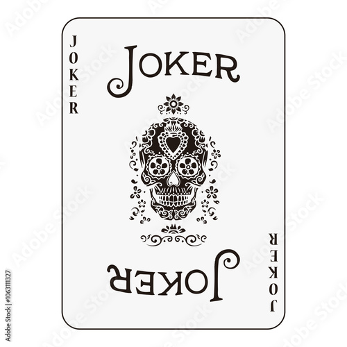 Joker playing card with intricate black skull design, unique and ornate style.
