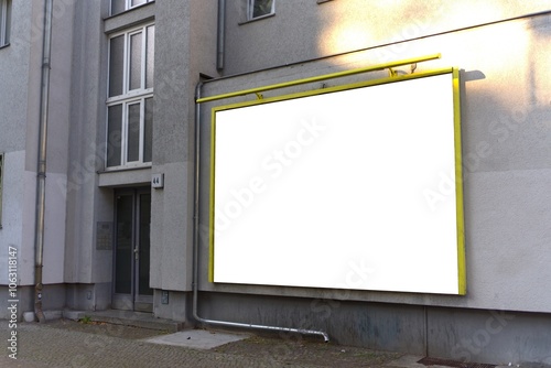 Wide format billboard on a house wall in Berlin.