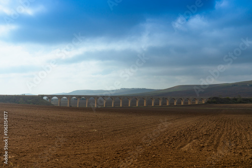 Φωτογραφία Historic railroad stone arch bridge near Spinazzola