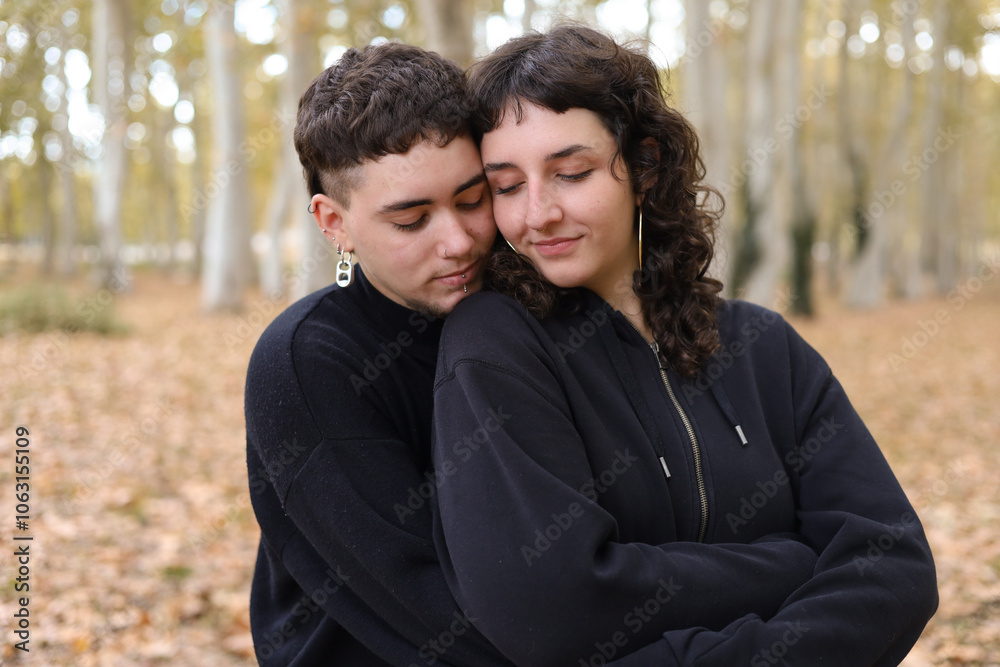 Intimate moment of LGBTQIA+ couple in an autumn setting Intimate moment of LGBTQIA+ couple in an autumn setting
