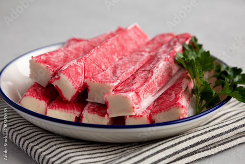 Organic Imitation Crab Meat Sticks on a Plate, side view. photo