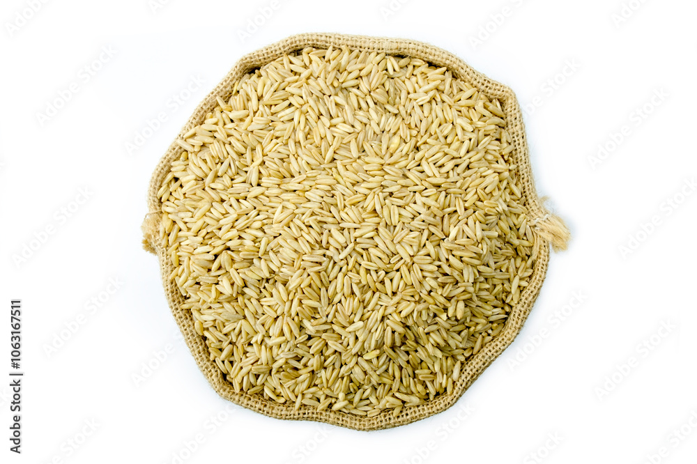 A sack bag of whole raw oat isolated on white background top view flat lay stacking. Super functional food , healthy eating, super food concept. A sack bag of whole raw oat isolated on white background top view flat lay stacking. Super functional food , healthy eating, super food concept.