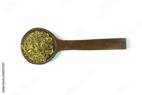 A wooden spoon of dried oregano or Origanum vulgare isolated on white background top view flat lay.