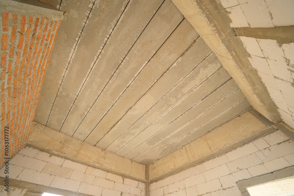 Obraz premium Under construction home or house with scaffolding on site in village. Old unfurnished rental property, living space units. lifestyle. Renovation.