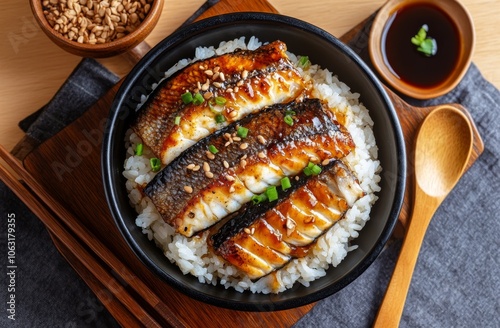 Delicious unagi donburi grilled eel over rice with savory sauce and garnish