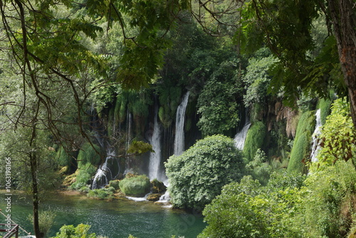 The wonderful streams of the Kravica waterfall, surrounded by greenery, in Ljubuski (Bosnia and Herzegovina) photo