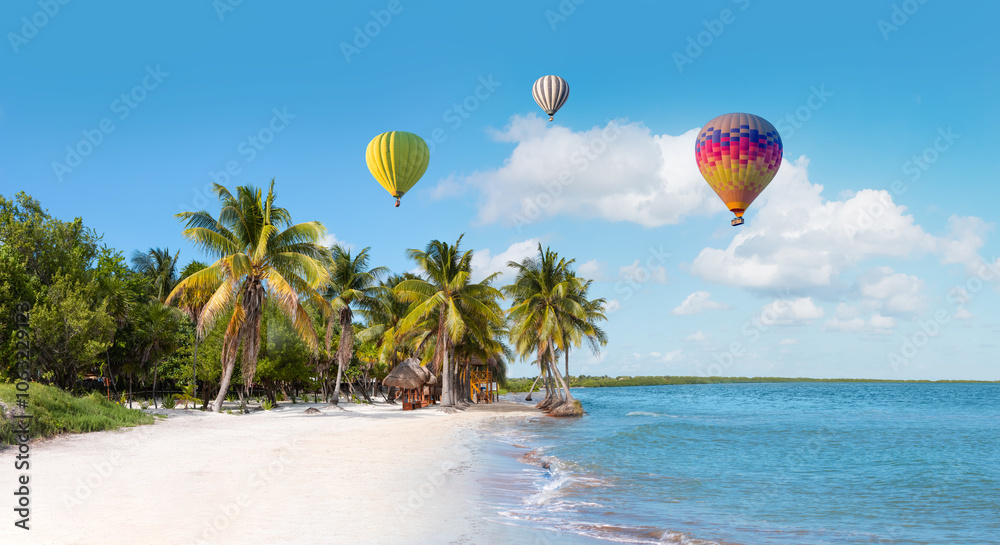 Hot air balloon flying over paradise Sunny beach with palms and turquoise sea. Summer vacation and tropical beach concept. Hot air balloon flying over paradise Sunny beach with palms and turquoise sea. Summer vacation and tropical beach concept.