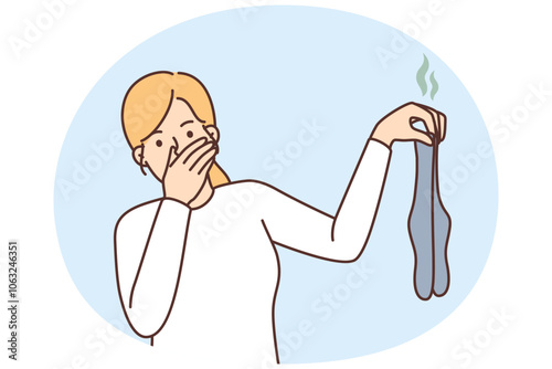 Woman disgusted with smelly dirty socks