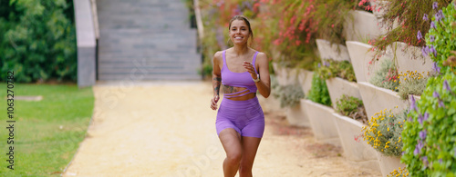 An Enthusiastic Active Woman Jogging with Joy in a Beautiful Nature Trail Setting