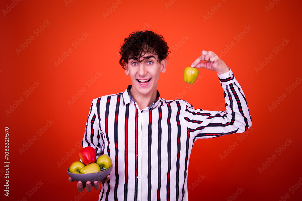 Funny curly young man posing in studio. Funny curly young man posing in studio.