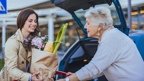 Smiling Women Unloading Groceries in Parking Lot