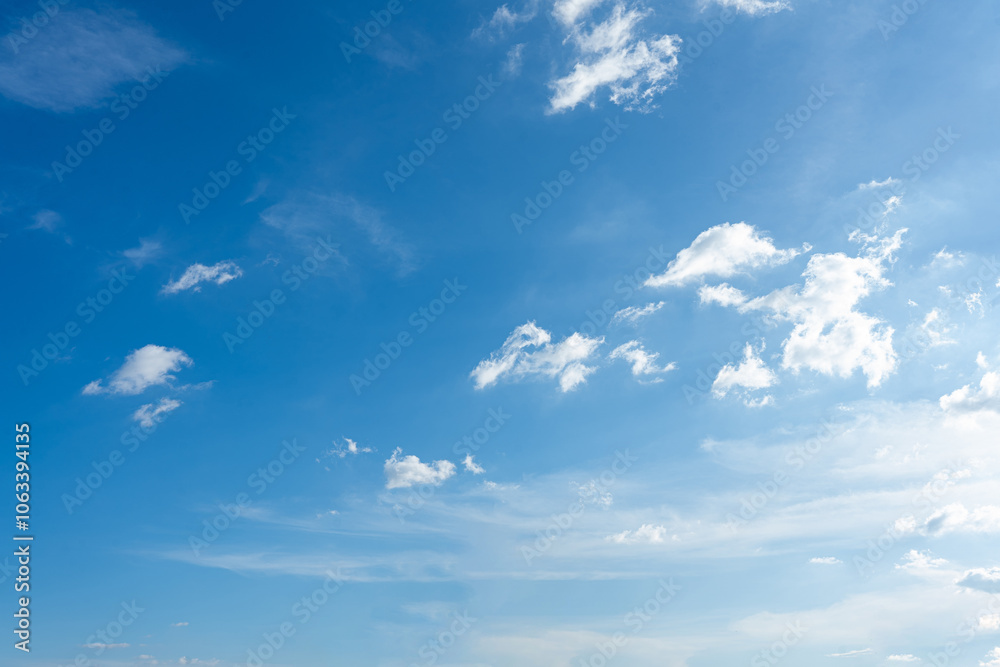 Beautiful fluffy white clouds drift across a bright blue summer sky Beautiful fluffy white clouds drift across a bright blue summer sky