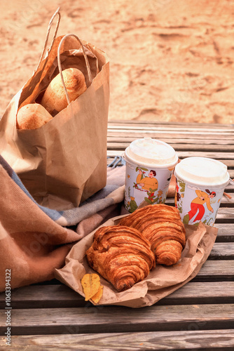 Wallpaper Mural autumn still life: croissants with coffee, baguette on the beach Torontodigital.ca