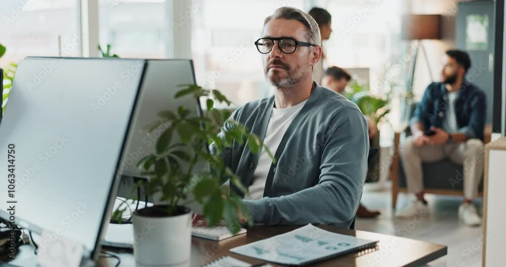 Computer, glasses and web development with man software engineer in office for coding or programming. Desktop, reading and typing with mature employee in workplace for design or online research