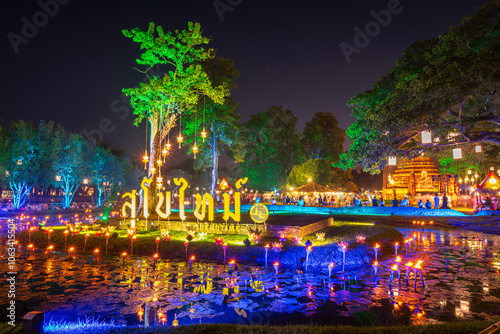 Beautiful scene of The light color Sukhothai Co Lamplighter Loy Kratong Festival at The Sukhothai Historical Park covers the ruins of Sukhothai, in what is now Northern Thailand. photo