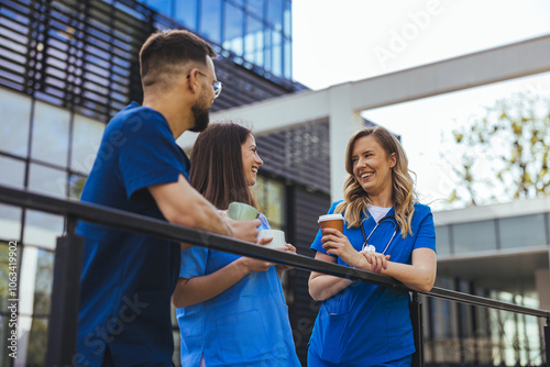 Medical Professionals Enjoying a Break Outside a Hospital photo