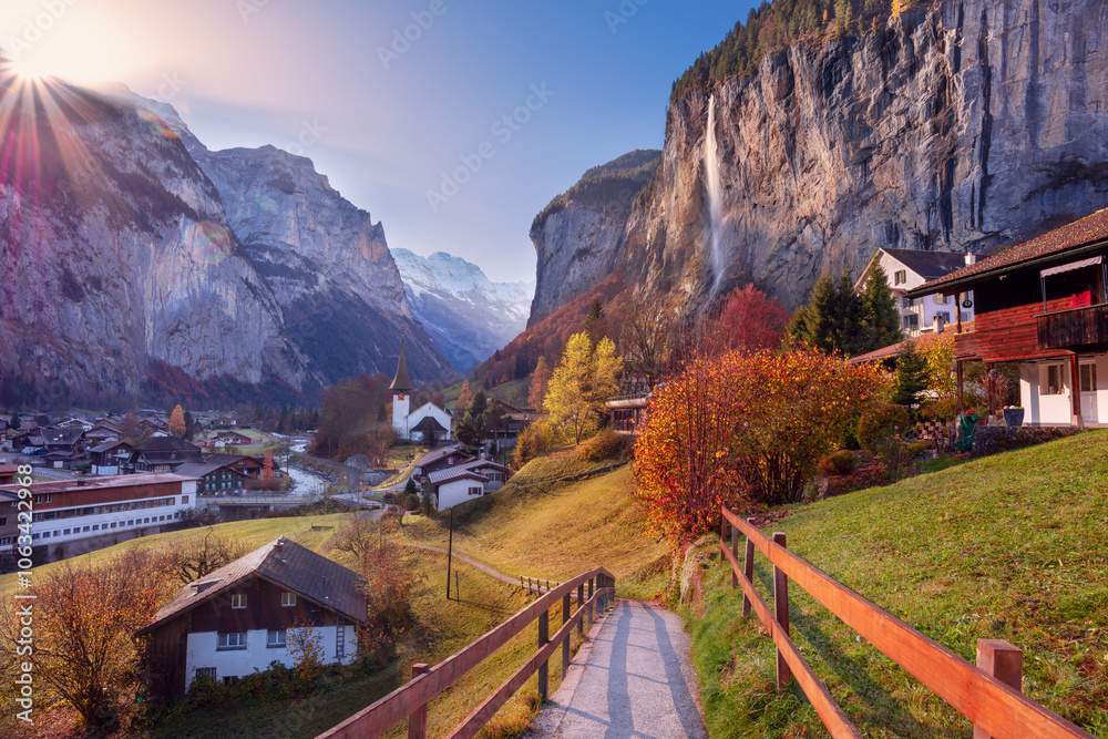 Lauterbrunnen, Switzerland. Landscape image of iconic village Lauterbrunnen, located in Swiss Alps, Switzerland at beautiful autumn sunrise.