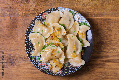 Dumplings filled with ground meat. Varenyky, vareniki, pierogi, pyrohy - dumplings with filling. View from above, top studio shot