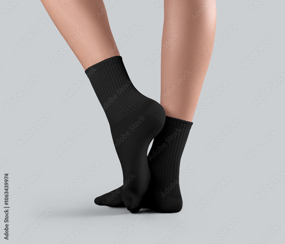 Mockup of black medium socks on female feet, side view, one ankle stretched, sportswear for foot, for design, print, advertising.
