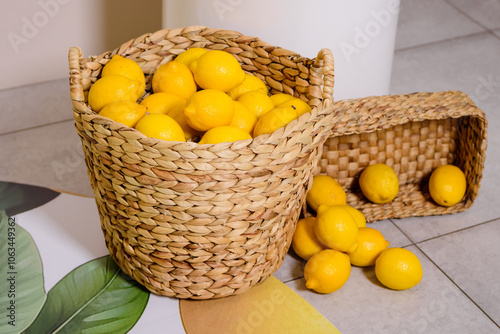 Ripe lemons in the wicker basket.