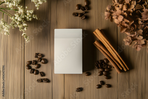 Minimalist photography of a coffee pack surrounded by coffee beans, cinnamon sticks, and dried flowers on a wooden surface photo