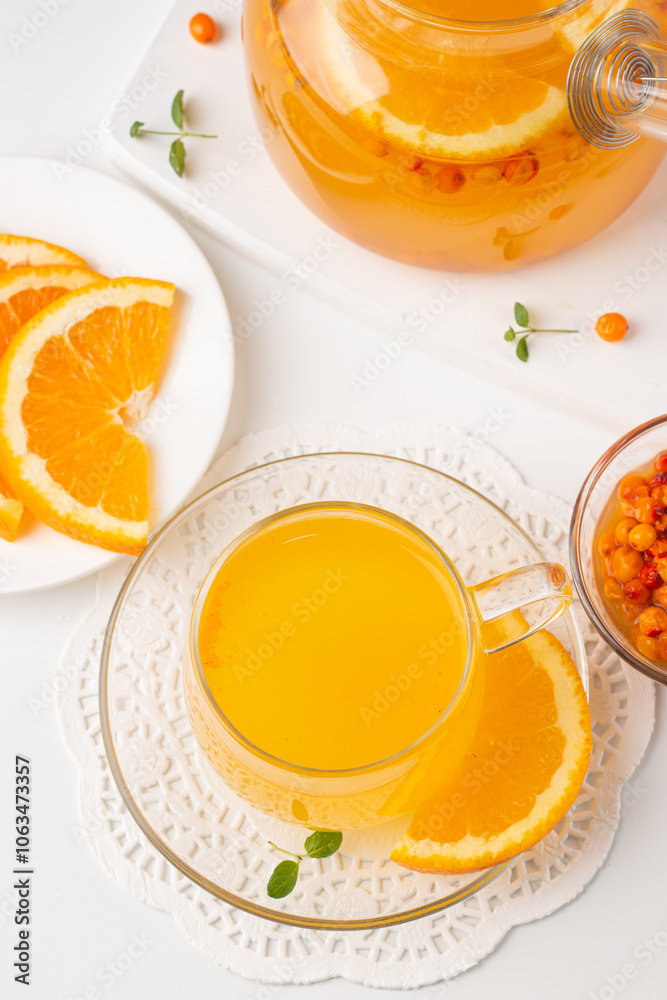 Sea buckthorn tea drink with oranges and mint. Autumn comfort hot drink. Herbal vitamin tea. Sea buckthorn tea drink with oranges and mint. Autumn comfort hot drink. Herbal vitamin tea.