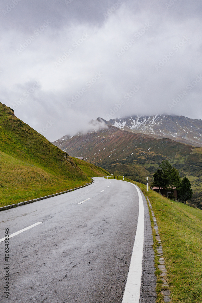 A beautiful road in the mountains, a landscape of a road that crosses the Alps. A beautiful road in the mountains, a landscape of a road that crosses the Alps.