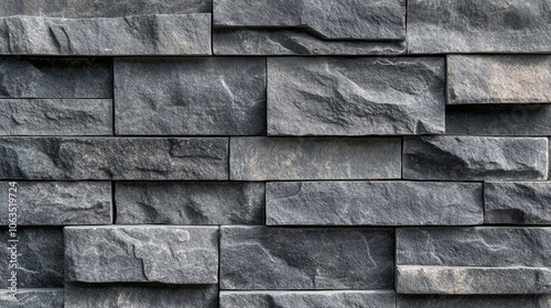 Close-up of a dark grey snow brick wall paneling, ideal for interior design. This versatile photo captures the textured snow brick wall for use in a wide banner or background. photo