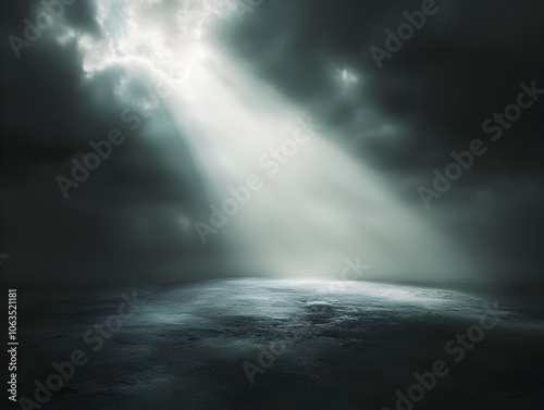 A Soft Beam of Light Breaking Through the Dramatic Clouds Illuminating a Single Spot in a Vast Dark Landscape