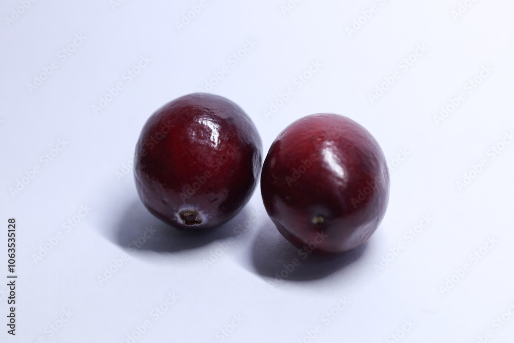 red cranberries on white background, macro shot red cranberries on white background, macro shot